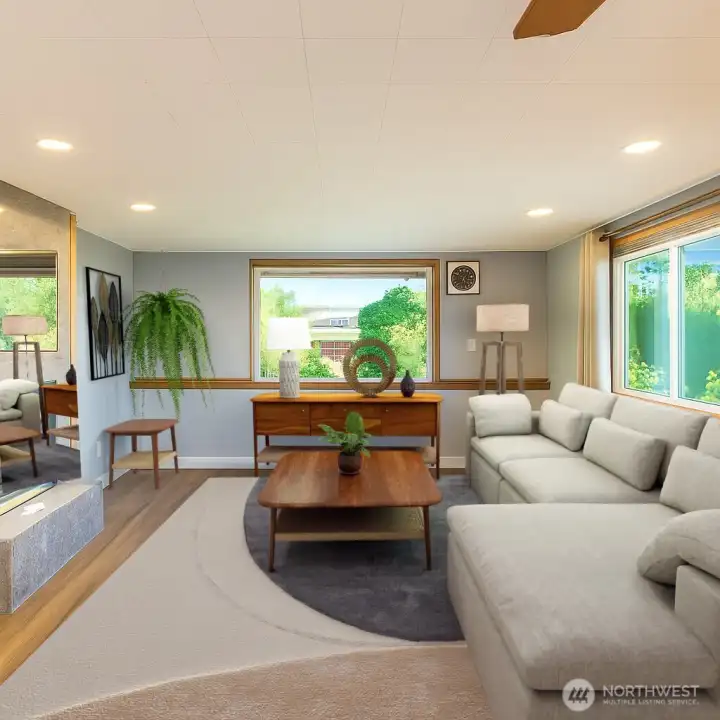 Lower level living complete with gas fireplace. (Staged to Scale)