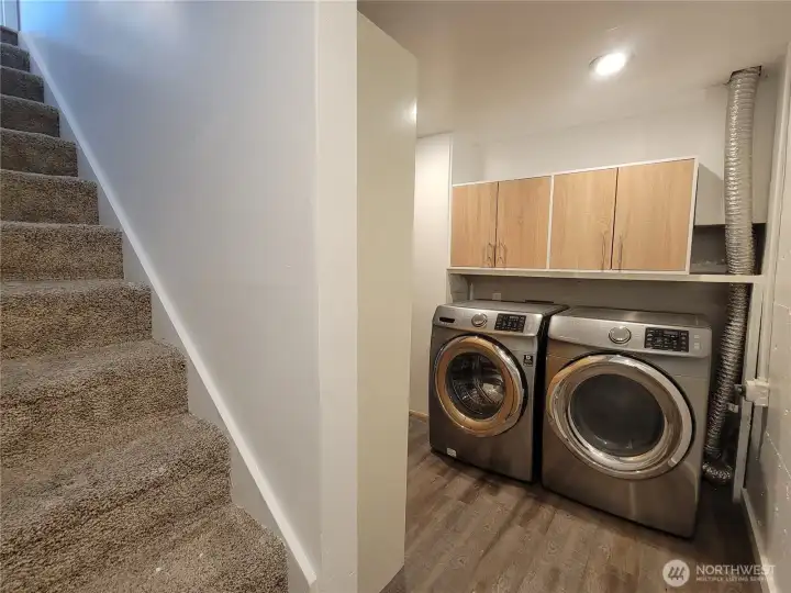 Utility area on lower level with storage joins the two levels of living.