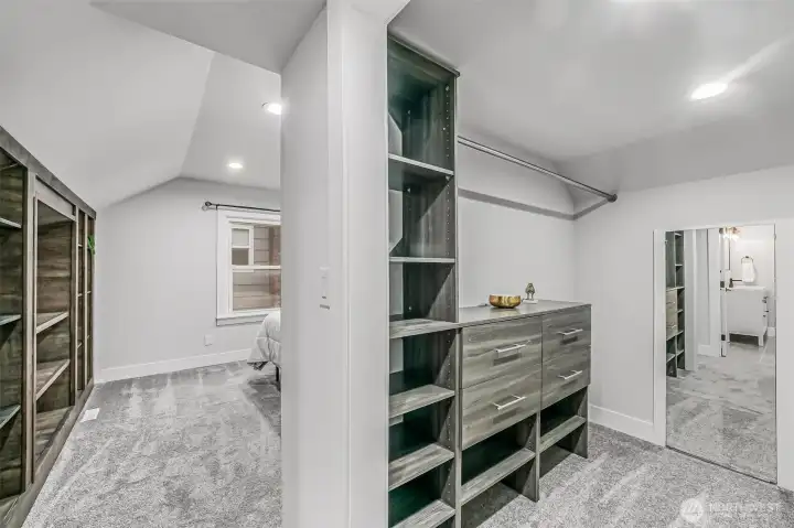 Primary Bedroom closet with built in shelving