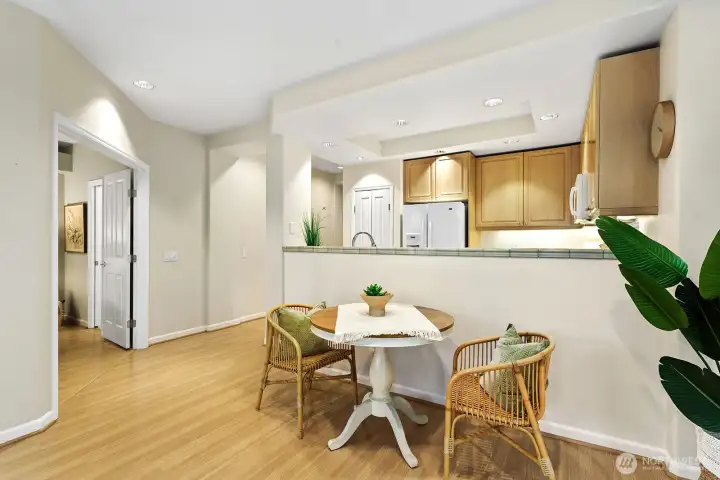 Here looking back on the left to the French doors, entry to the primary bedroom. open kitchen, dining area and the entry hallway view also.