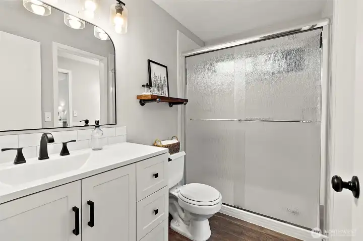 Beautifully Remodeled Bathroom with New Vanity, Shower, Light Fixtures and More!