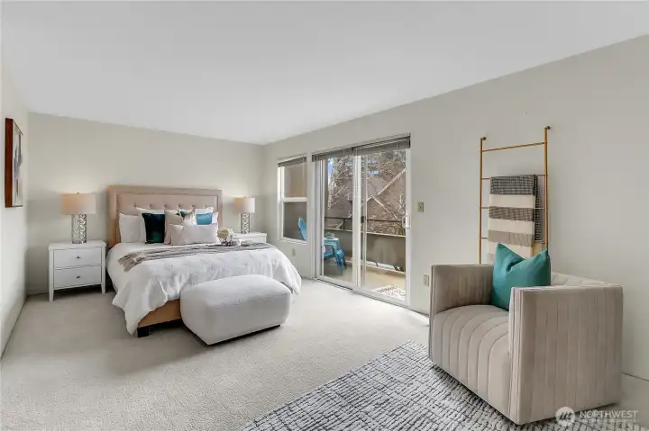 Large primary bedroom with personal deck, double closets, and en-suite bathroom.