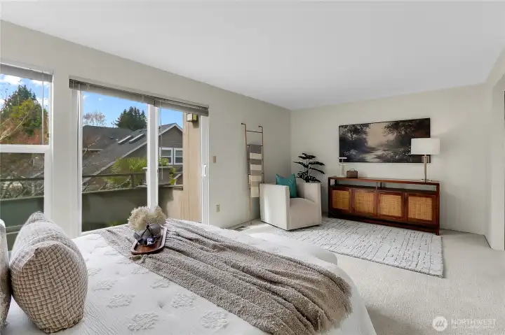 Large primary bedroom with personal deck, double closets, and en-suite bathroom.