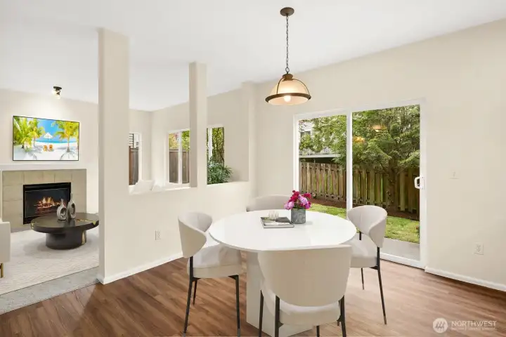 Casual kitchen eating area with view to backyard.