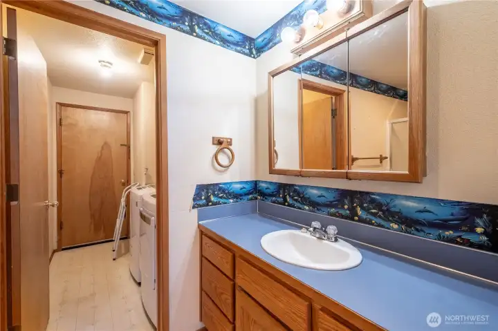 Hallway bathroom and laundry. Also entrance to the garage
