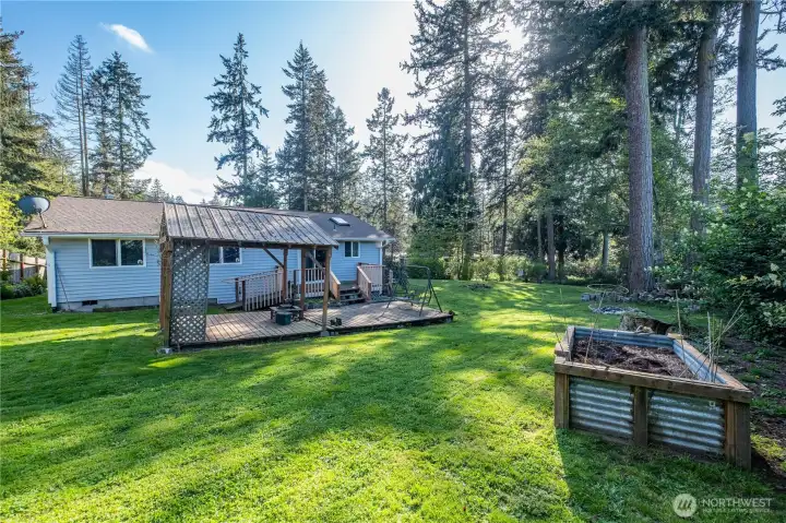 Lots of yard to enjoy and a planter box to grow some veggies