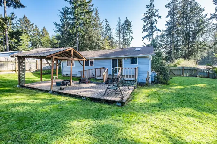 Back yard looking at deck and home