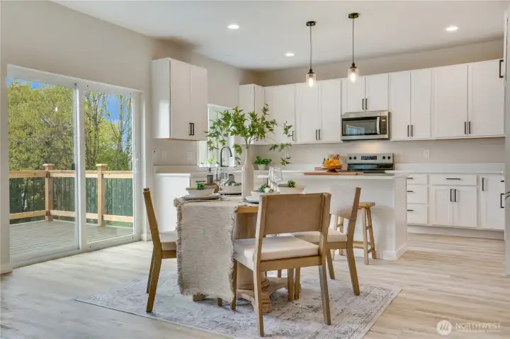 Sliding glass doors to the view deck with a territorial view, with city lights in the background.