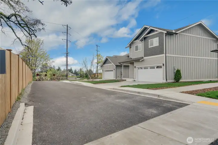 Three new homes here on this quiet road.