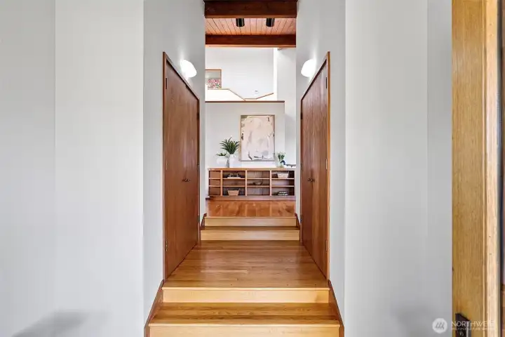 Double doors open to the front entry, flanked by two large closets