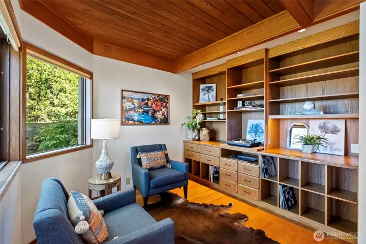 Cozy den off the living room with custom shelving for Hi-Fi equipment and records