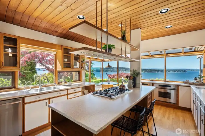 Custom kitchen with central island and gas cooktop