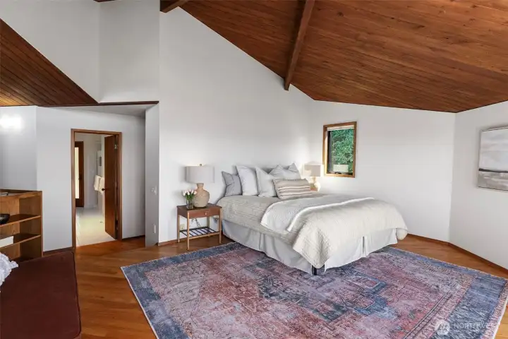 Primary bedroom takes full advantage of the views