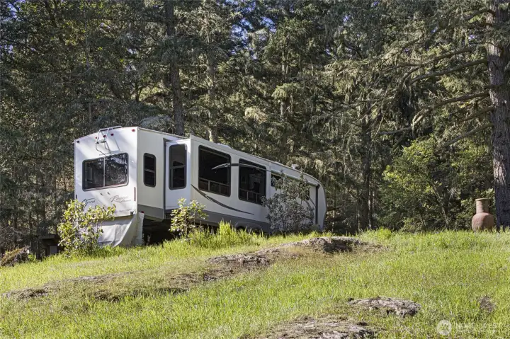 Existing RV pad offers immediate functionality and a comfortable place to enjoy island living while planning your future custom home. RV available for purchase separately and not included in sale.