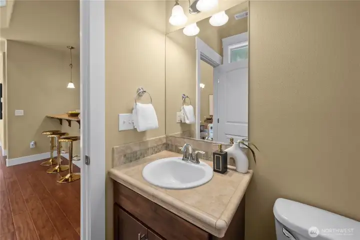 The main-floor powder room is convenient for guests to use. The main-floor powder room is convenient for guests to use.