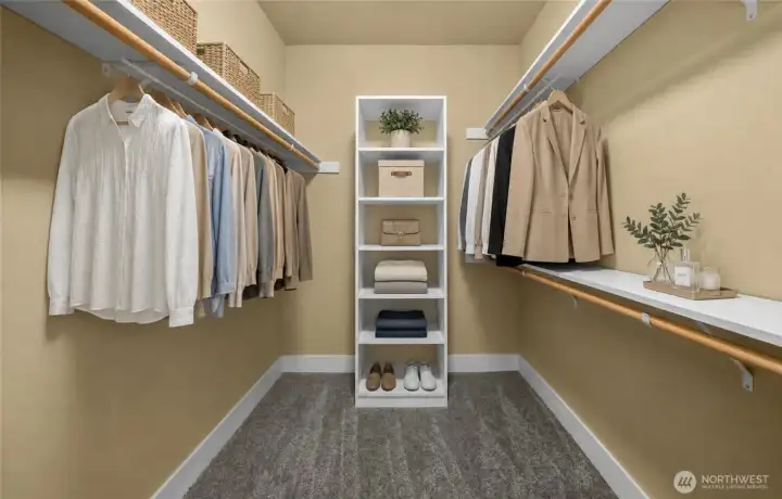 Primary Suite's expansive walk-in closet is thoughtfully designed with abundant hanging space, built-in shelving, and exceptional organization to accommodate every wardrobe. (photo virtually staged) Primary Suite's expansive walk-in closet is thoughtfully designed with abundant hanging space, built-in shelving, and exceptional organization to accommodate every wardrobe. (photo virtually staged)