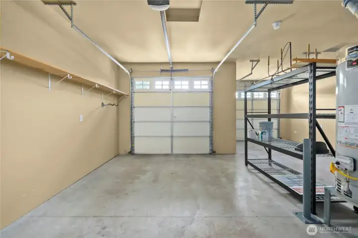 You'll love the fully finished 2-car garage with plenty of storage & metal shelving. You'll love the fully finished 2-car garage with plenty of storage & metal shelving.