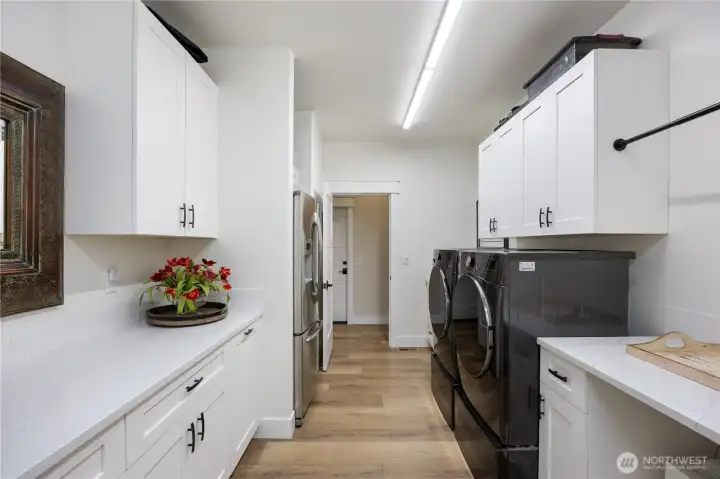 Generous Laundry with plenty of storage and a laundry sink