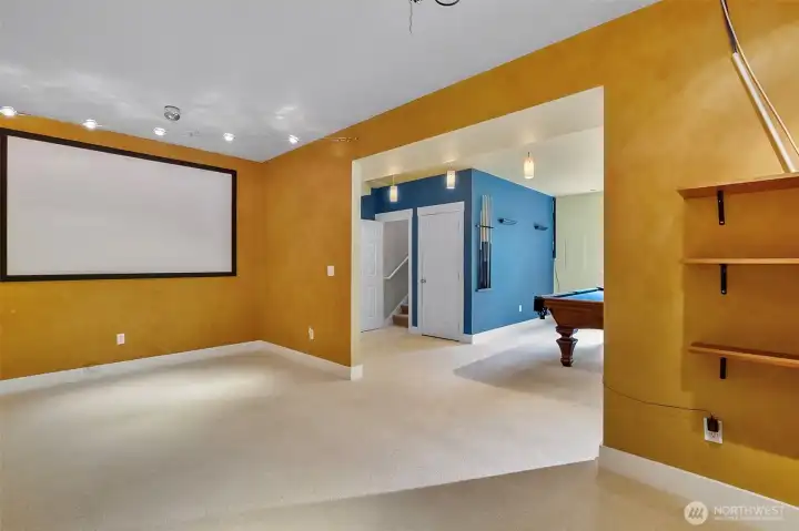 Media Room in basement with a projector Media Room in basement with a projector