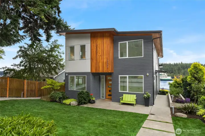 Welcome to the front yard space with the kitchen garden to the right and the waterfront down the path.
