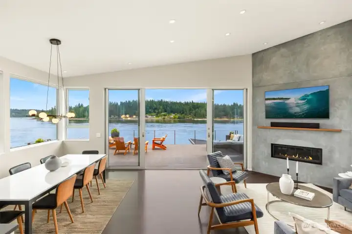 The gracious dining area will support a large table for all of your gatherings and the living space is anchored by a floor to ceiling fireplace wall.