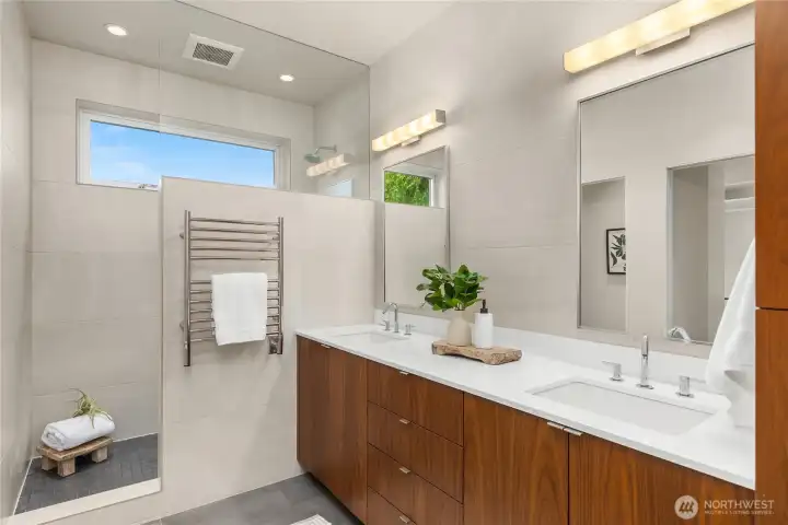 The primary bath with heated floors and towel racks. Comfort and warmth.