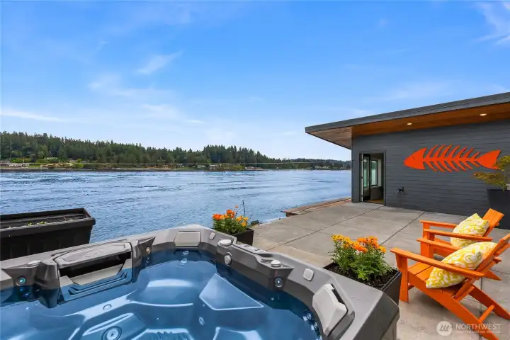 The hot tub on the lower patio and the boat house