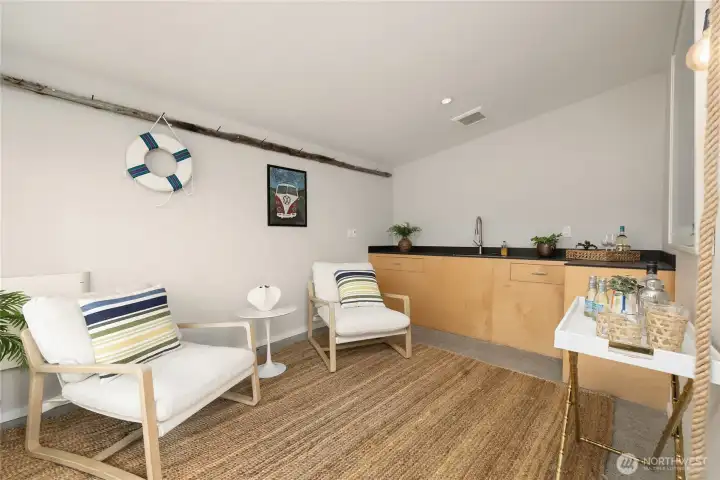 The boat house has a fun design and a sink. A great space to play!