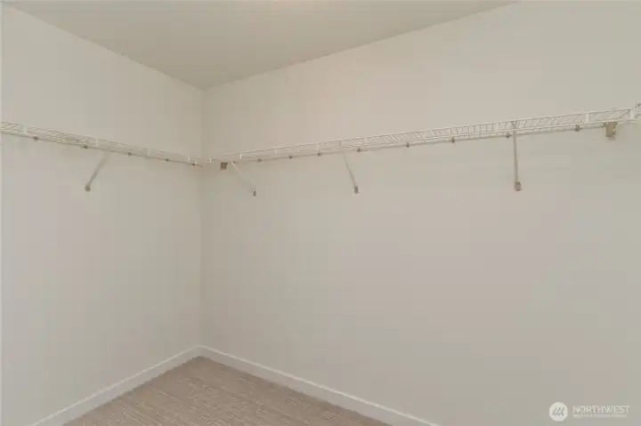 Primary walk-in closet. Primary walk-in closet.