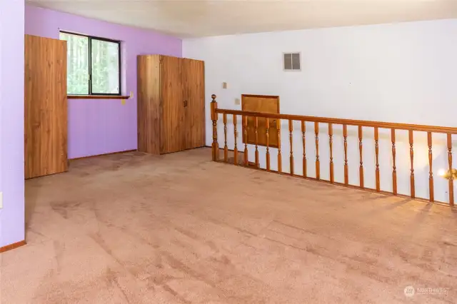 Primary bedroom loft with full bath.