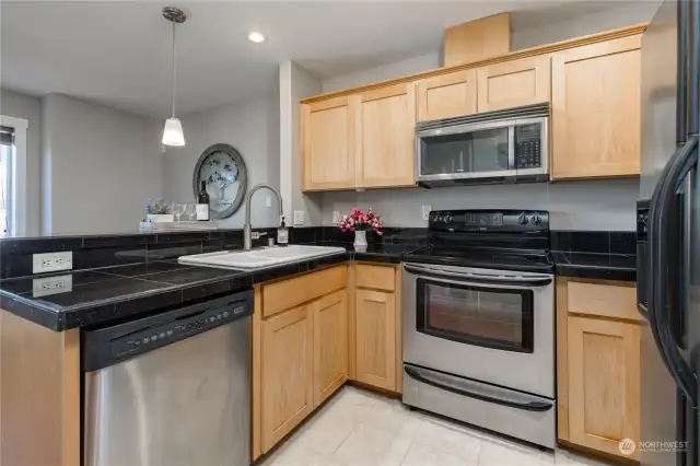 Fully-equipped kitchen with stainless appliances