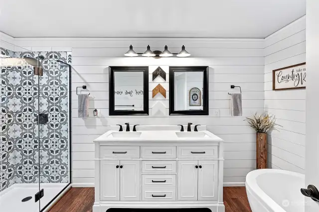 All new primary bath with soaking tub, tile shower, granite vanity and new fixtures and shiplap surround.