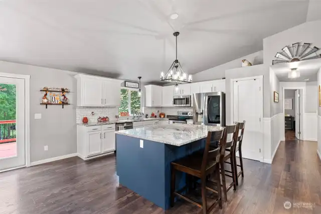 Oversized, custom island in kitchen, SS appliances, pantry, new granite countertops & tile backsplash. InstaView fridge included.