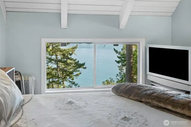 Beautiful view from primary bed makes a perfect natural setting to wake up to and enjoy a great day on island time.