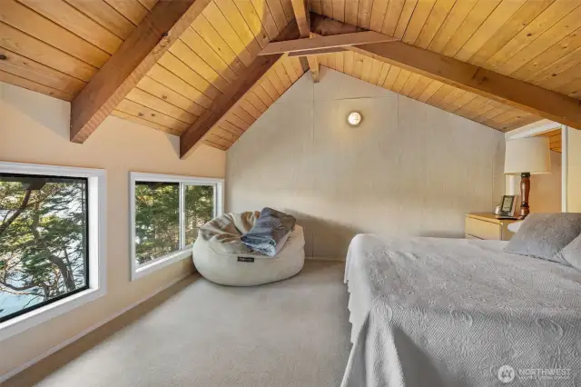 Large bonus room set up as a sleeping area with spectacular water views.