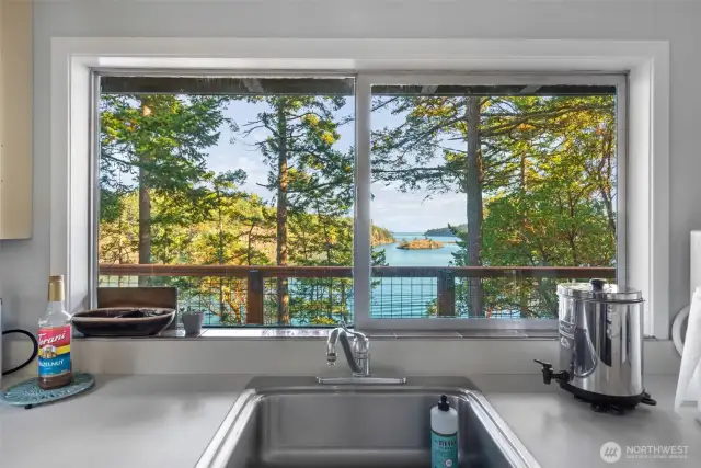 View of the ocean while cleaning up after family meals.