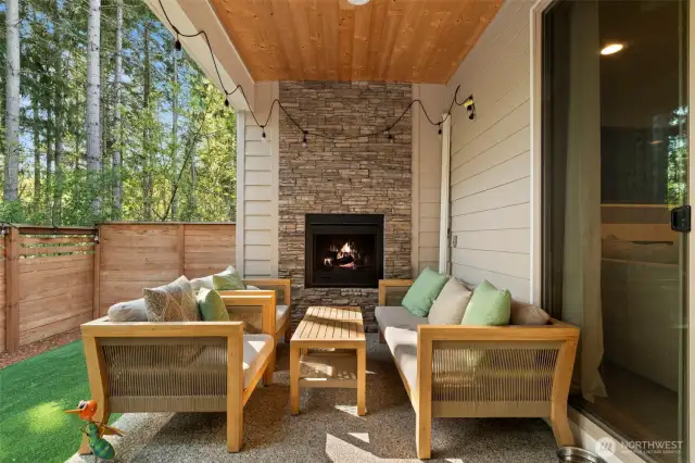 Imagine drinking your morning coffee next to this cozy outdoor fireplace!