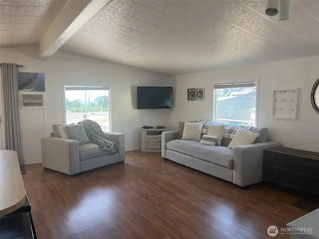 Living space with valted ceilings.