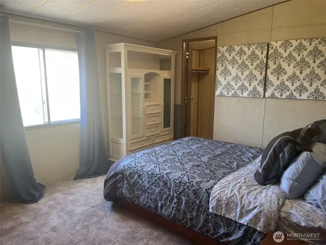Main bedroom with adjoining full bath. Large room with a walk in closet.