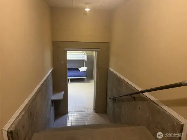 Stairs leading down to the large bonus room with a 34/ bath.