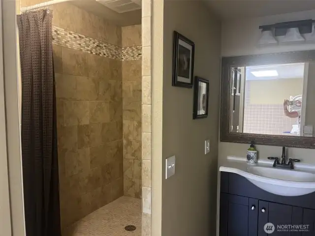 Nice walk in tile shower.