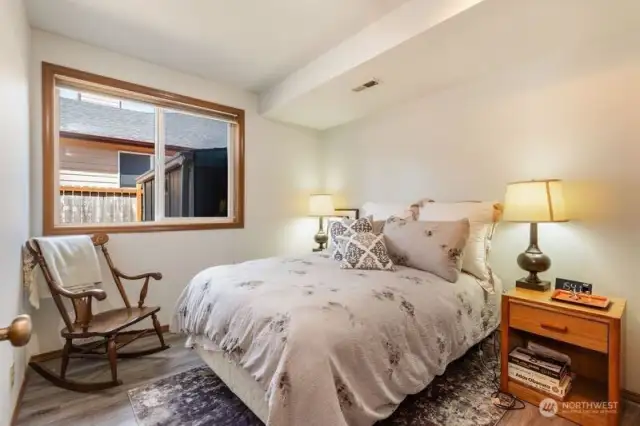 Guest bedroom conveniently located on the lower level of the tri-level adjacent to the 1/2 bath.