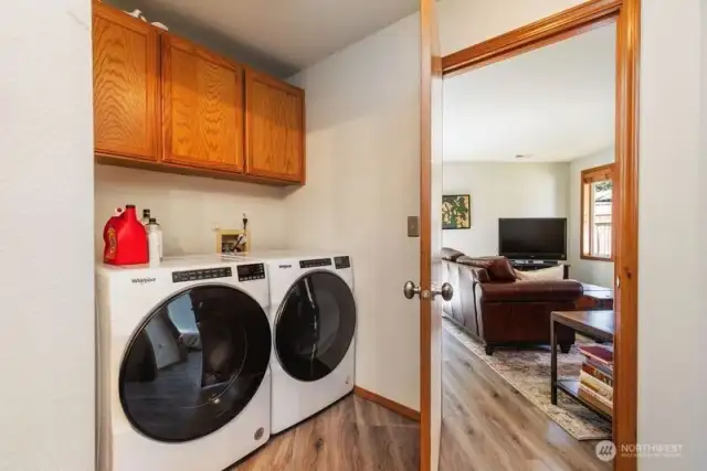 Laundry room with built in cabinets.