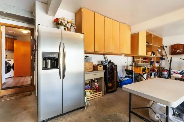 Large 3 car garage with built in overhead cabinets.