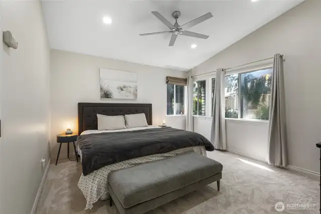 Primary bedroom with vaulted ceilings