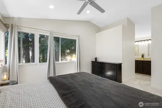 Primary bedroom with vaulted ceilings
