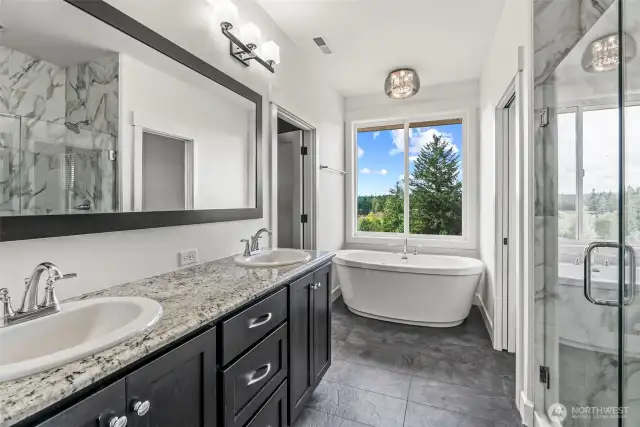 Master bath with double sinks and soaking tub