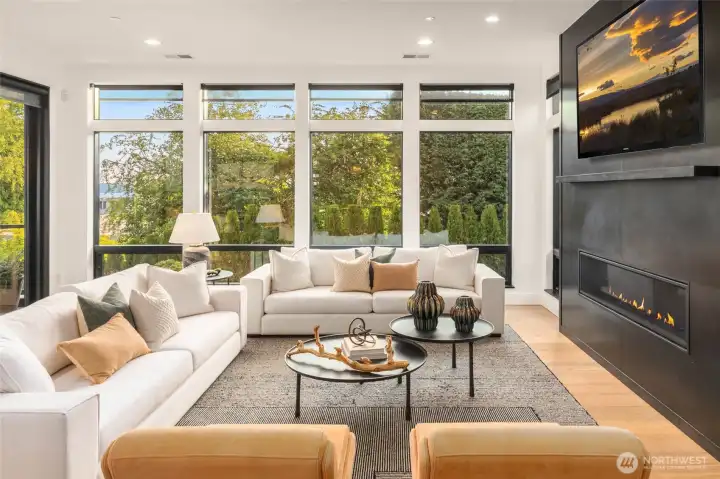 All Great room windows feature custom designed motorized shades synced to lutron wall lighting switches