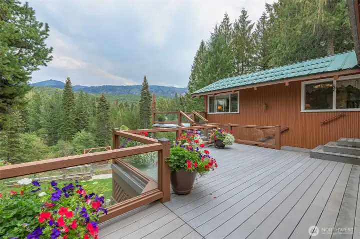 Impressive, generous composite and concrete decking wraps around the home to enjoy those incredible views!
