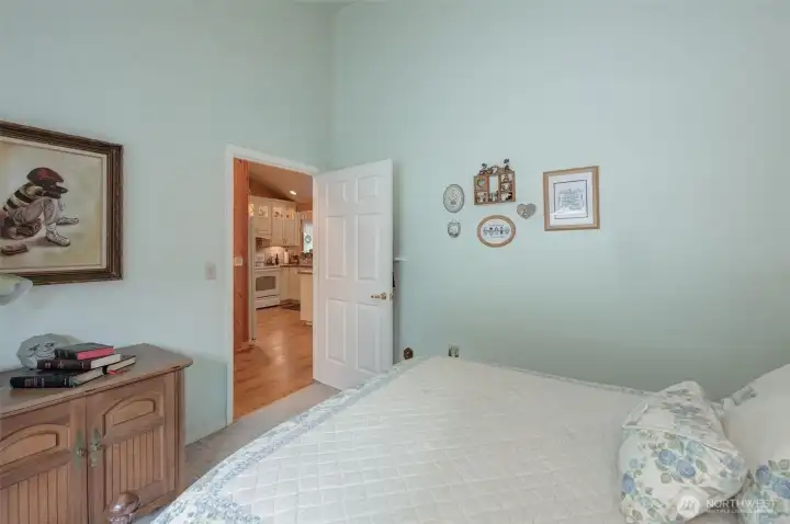 First guest bedroom is light & bright with vaulted ceiling